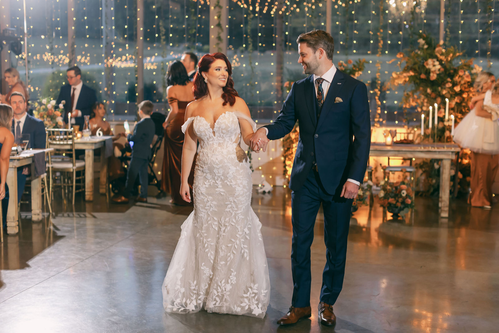 Bride and groom among manicured hedges